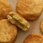 Close-up of gluten free snickerdoodle cookies recipe with crackly tops and soft centers on parchment paper
